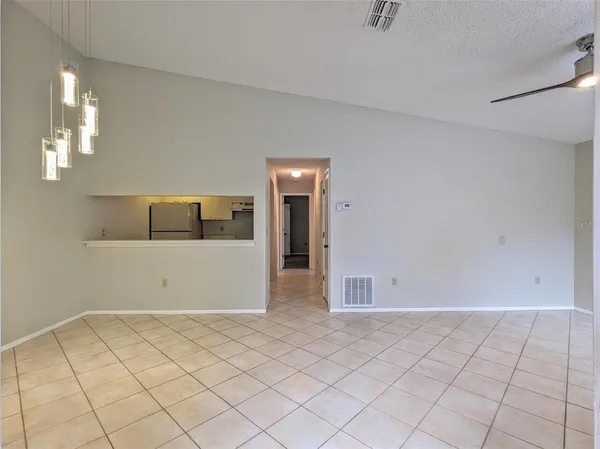 a view of an empty room with glass door