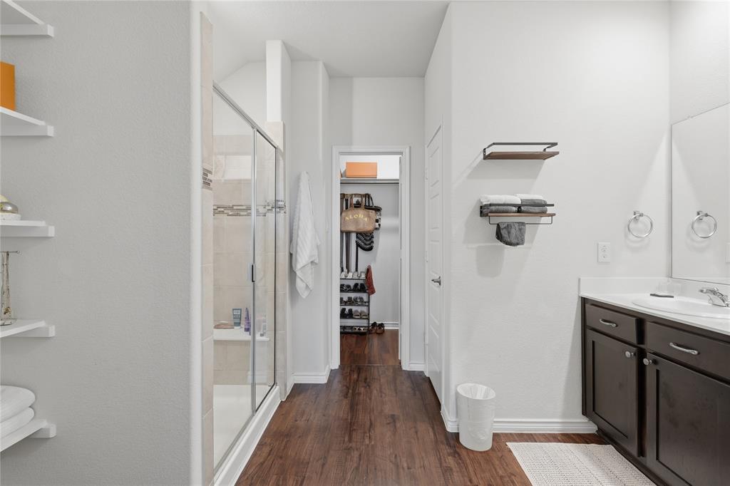 10101 Travis Road Little Elm, TX 75068 - Photo 21 of 26 a view of a hallway with wooden floor and staircase