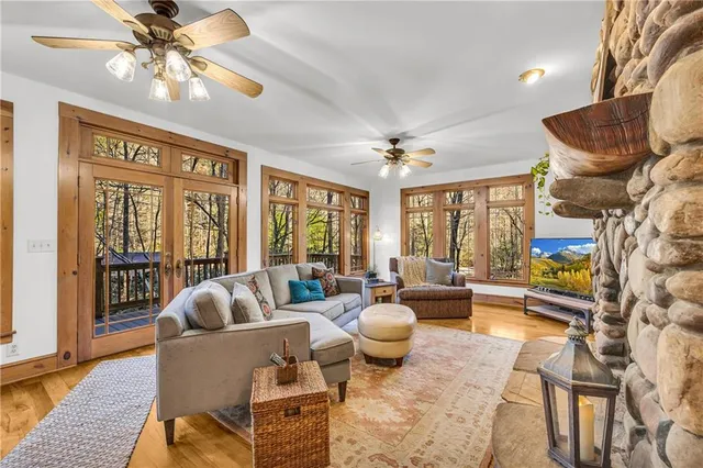 a view of a livingroom with furniture and a window