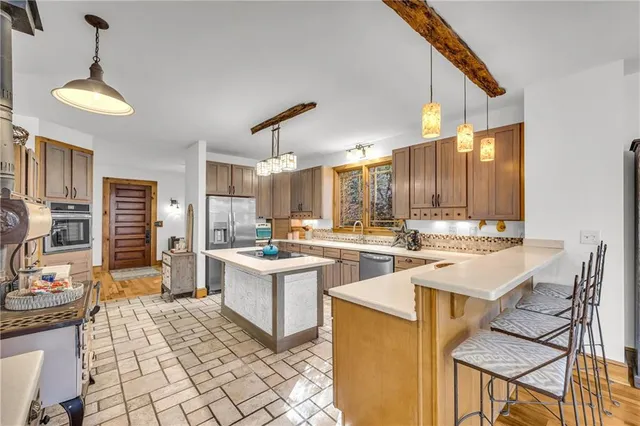 a bedroom with furniture and large windows