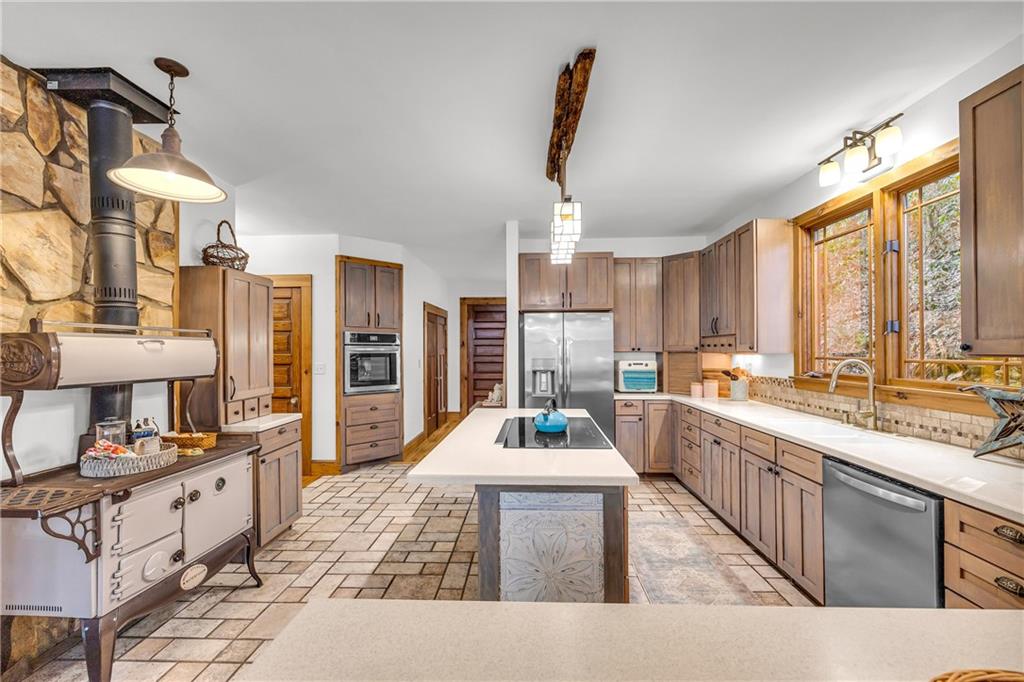 740 Little Rock Creek Road Cherry Log, GA 30522 - Photo 29 of 98 a kitchen with a sink stove and cabinets