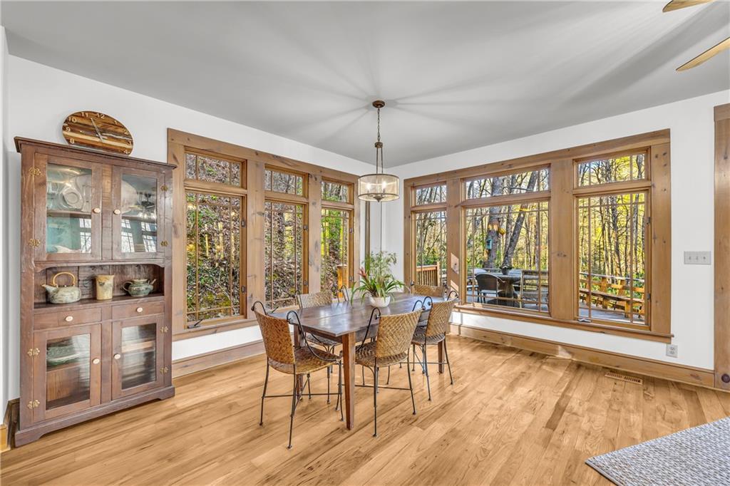 740 Little Rock Creek Road Cherry Log, GA 30522 - Photo 31 of 98 a dining room with furniture water view and wooden floor