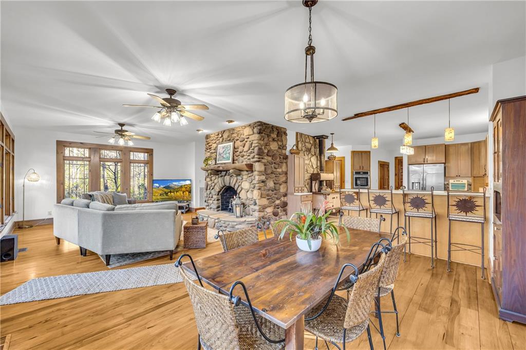 740 Little Rock Creek Road Cherry Log, GA 30522 - Photo 33 of 98 a view of a dining room with furniture wooden floor and chandelier