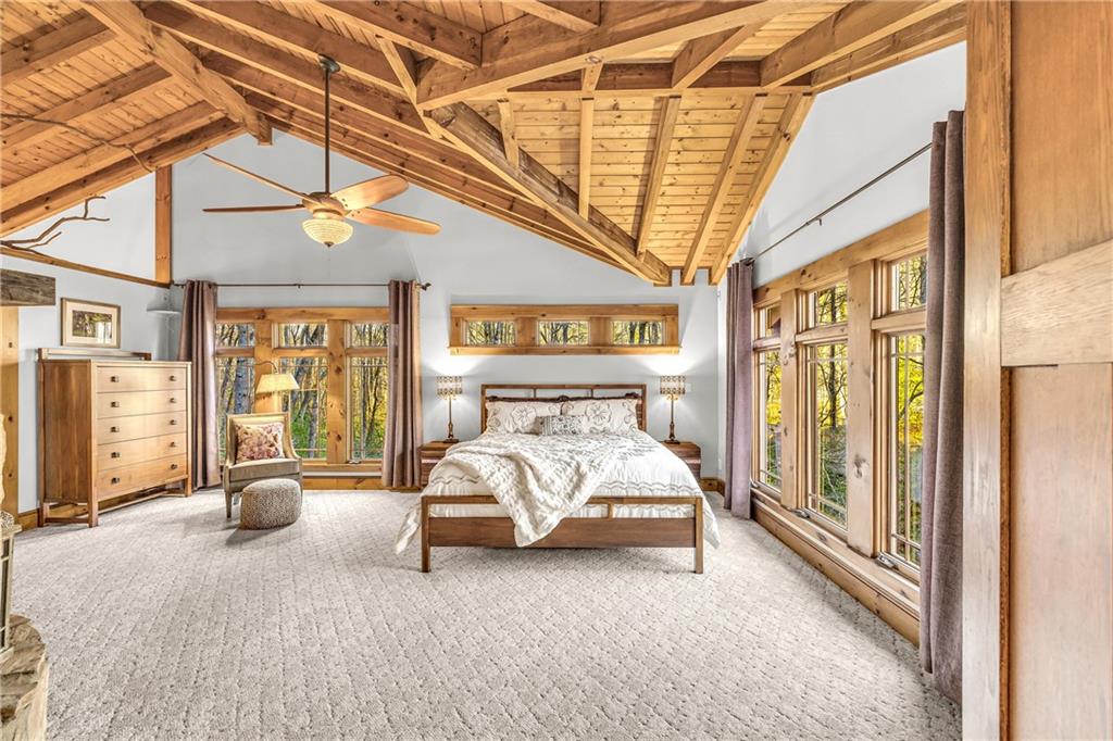 740 Little Rock Creek Road Cherry Log, GA 30522 - Photo 43 of 98 a spacious bedroom with a bed and a large window