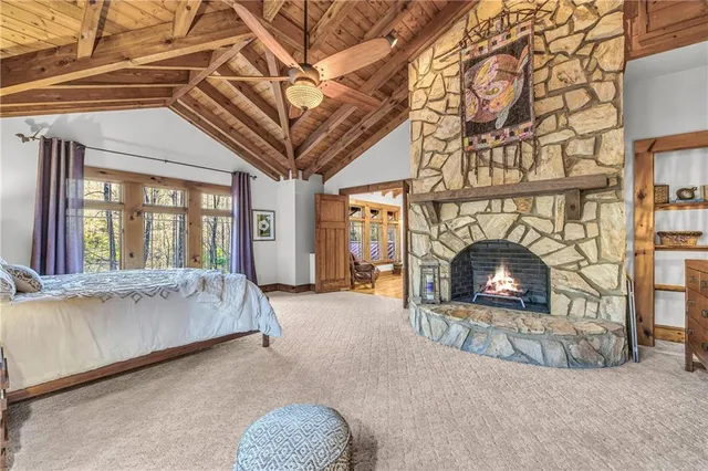 a room with wooden floor and a fireplace