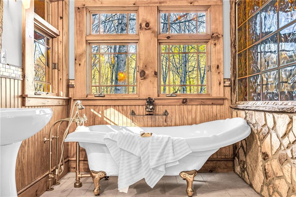 740 Little Rock Creek Road Cherry Log, GA 30522 - Photo 53 of 98 a bed sitting in a bedroom next to a window