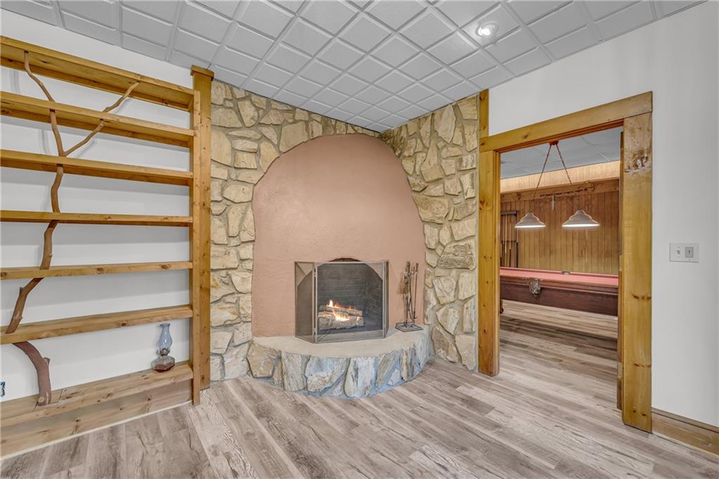 740 Little Rock Creek Road Cherry Log, GA 30522 - Photo 78 of 98 a room with wooden floor and a fireplace