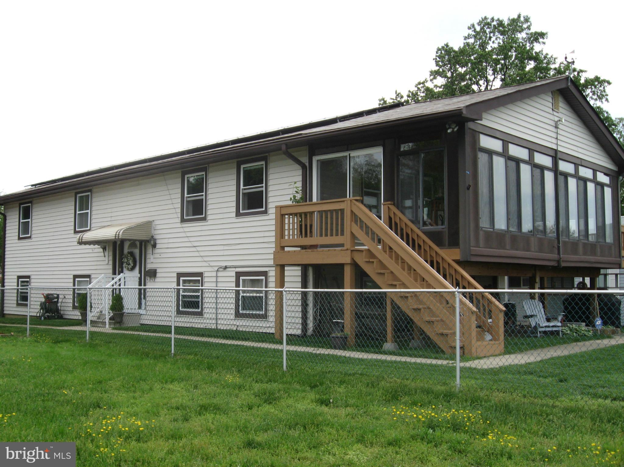 8545 Bay Road Pasadena, MD 21122 - Photo 29 of 30 View of home with sunroom