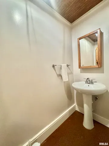 a bathroom with a sink and mirror