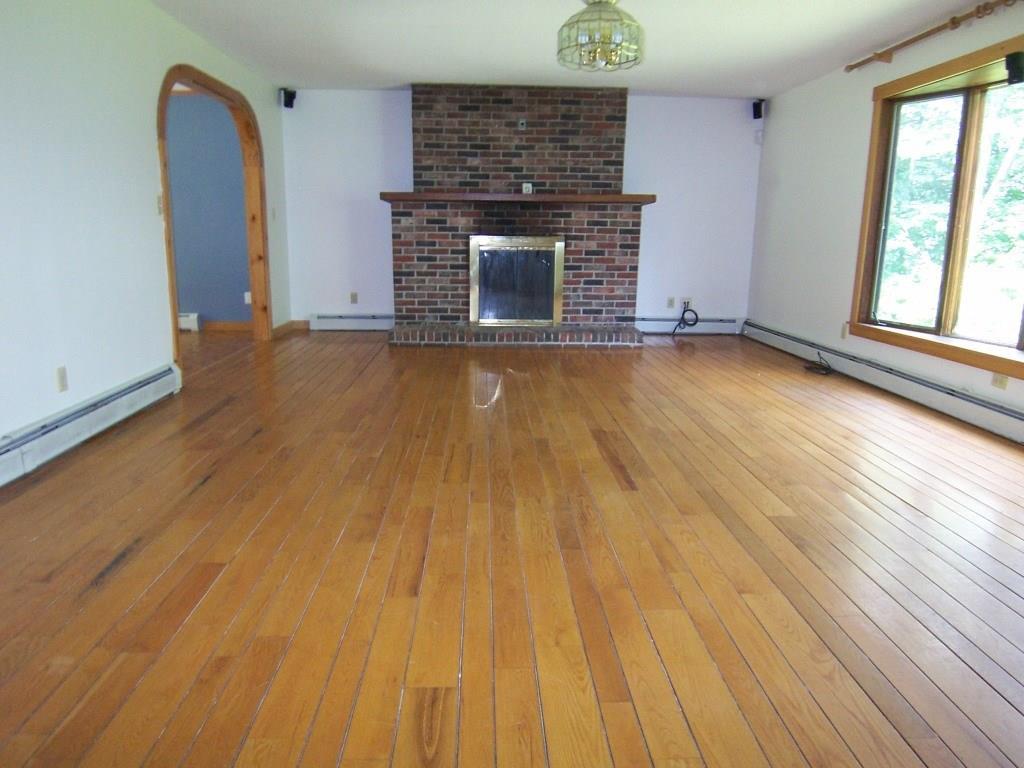 57 Farmington Road Strong, ME 04983 - Photo 2 of 28 Living Room, Fireplace, Oak Floors