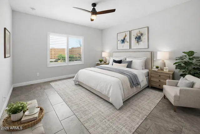 a living room with furniture a rug and a window