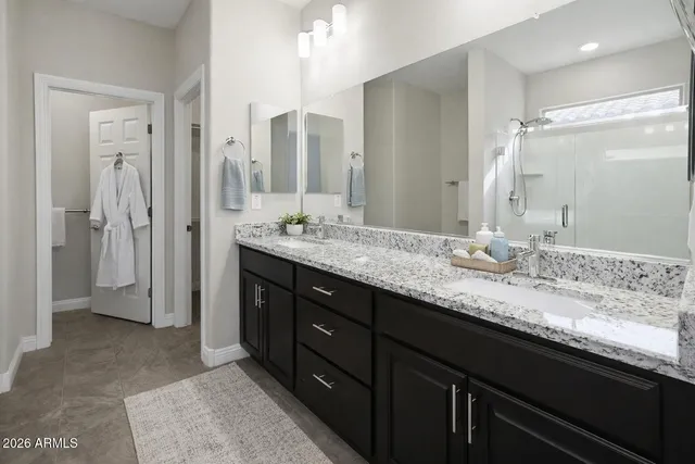 a view of a house with a yard and potted plants