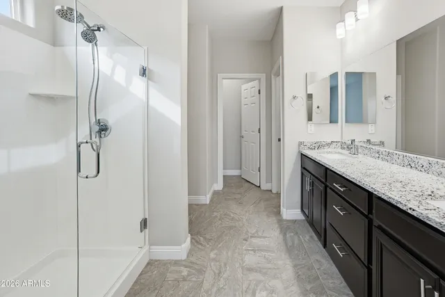 an aerial view of residential building with parking