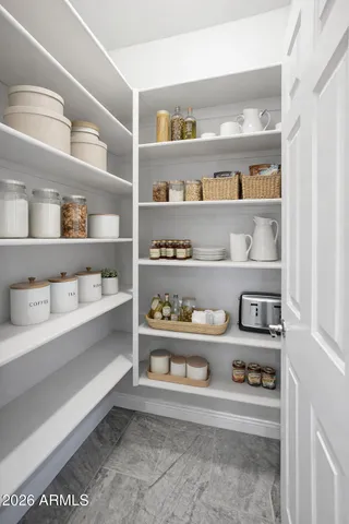 a spacious bathroom with a granite countertop sink mirror and a shower