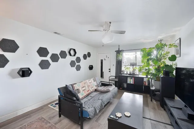a living room with furniture and a large window