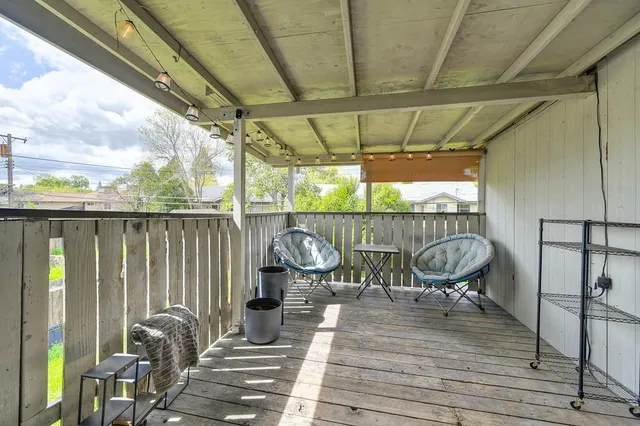 a view of a outdoor sitting area with furniture