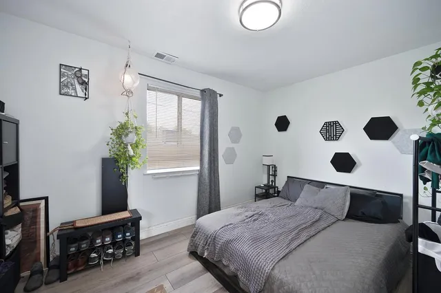 a bedroom with a bed and a window in it