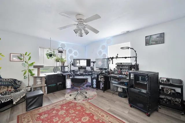 a living room with lots of furniture and kitchen view
