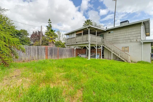 a house view with a garden space
