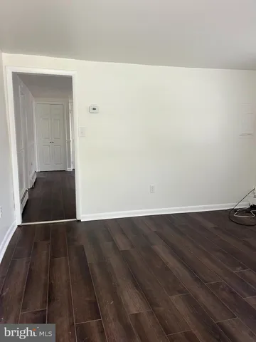 a view of a livingroom with wooden floor