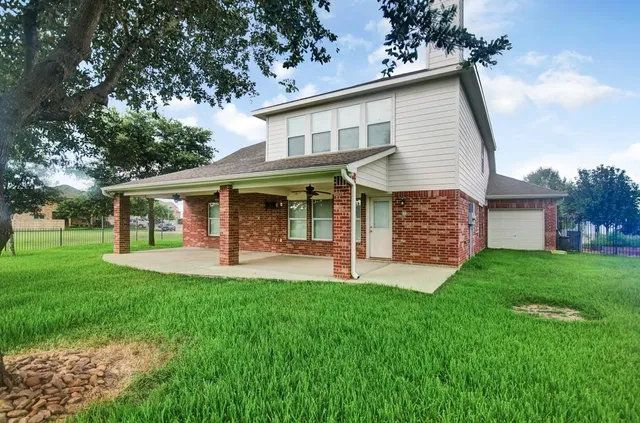 a front view of a house with a yard and porch