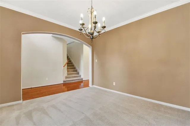 a view of a chandelier in big room and chandelier