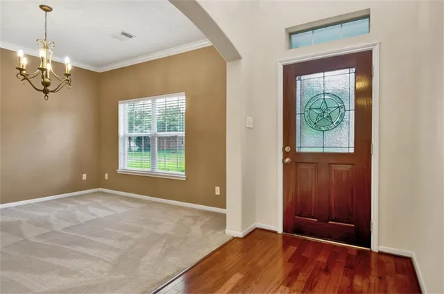 a view of livingroom with window and hardwood floor