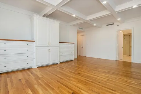 a bathroom with a double vanity sink mirror and shower