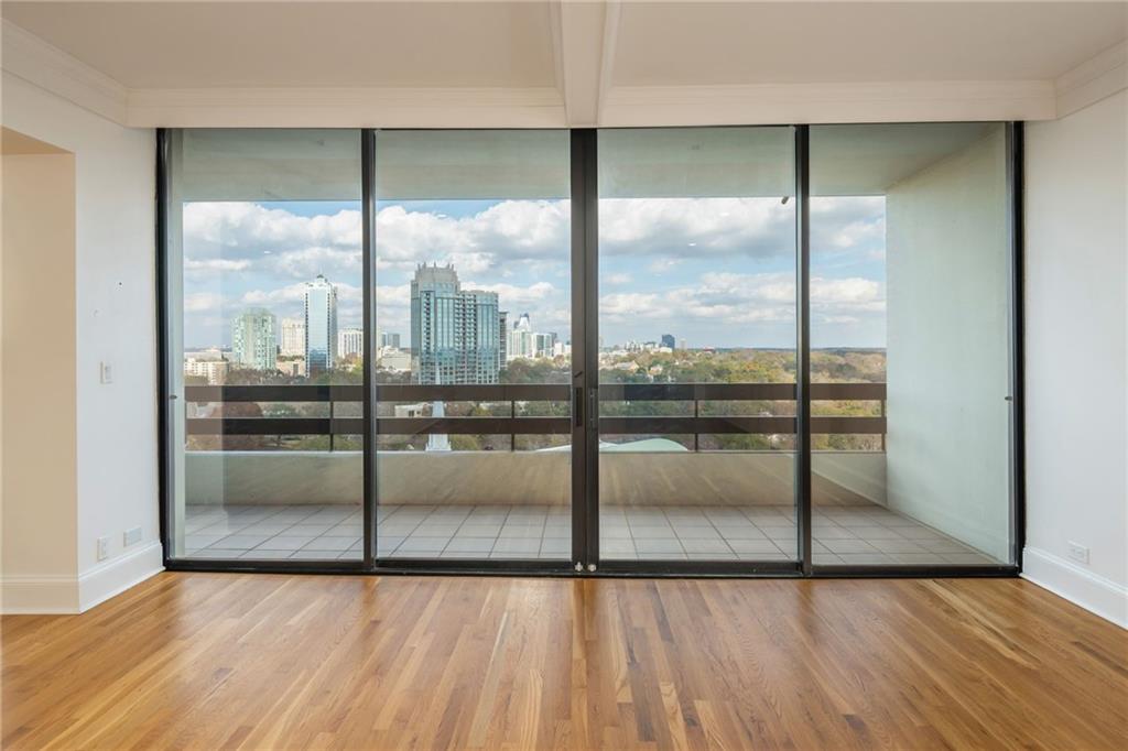2660 Peachtree Road Northwest, Unit 22E Atlanta, GA 30305 - Photo 4 of 48 a view of a glass door with a glass door