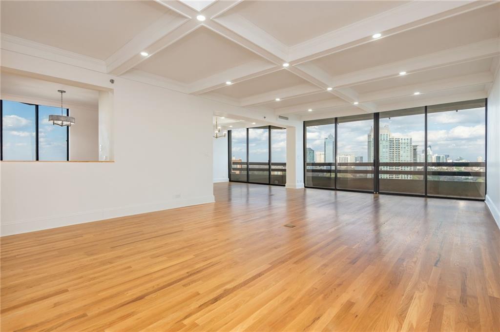 2660 Peachtree Road Northwest, Unit 22E Atlanta, GA 30305 - Photo 6 of 48 an empty room with wooden floor and windows