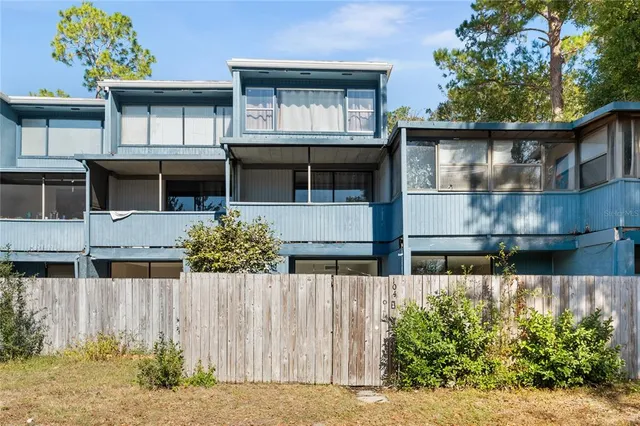 a front view of house with a garden