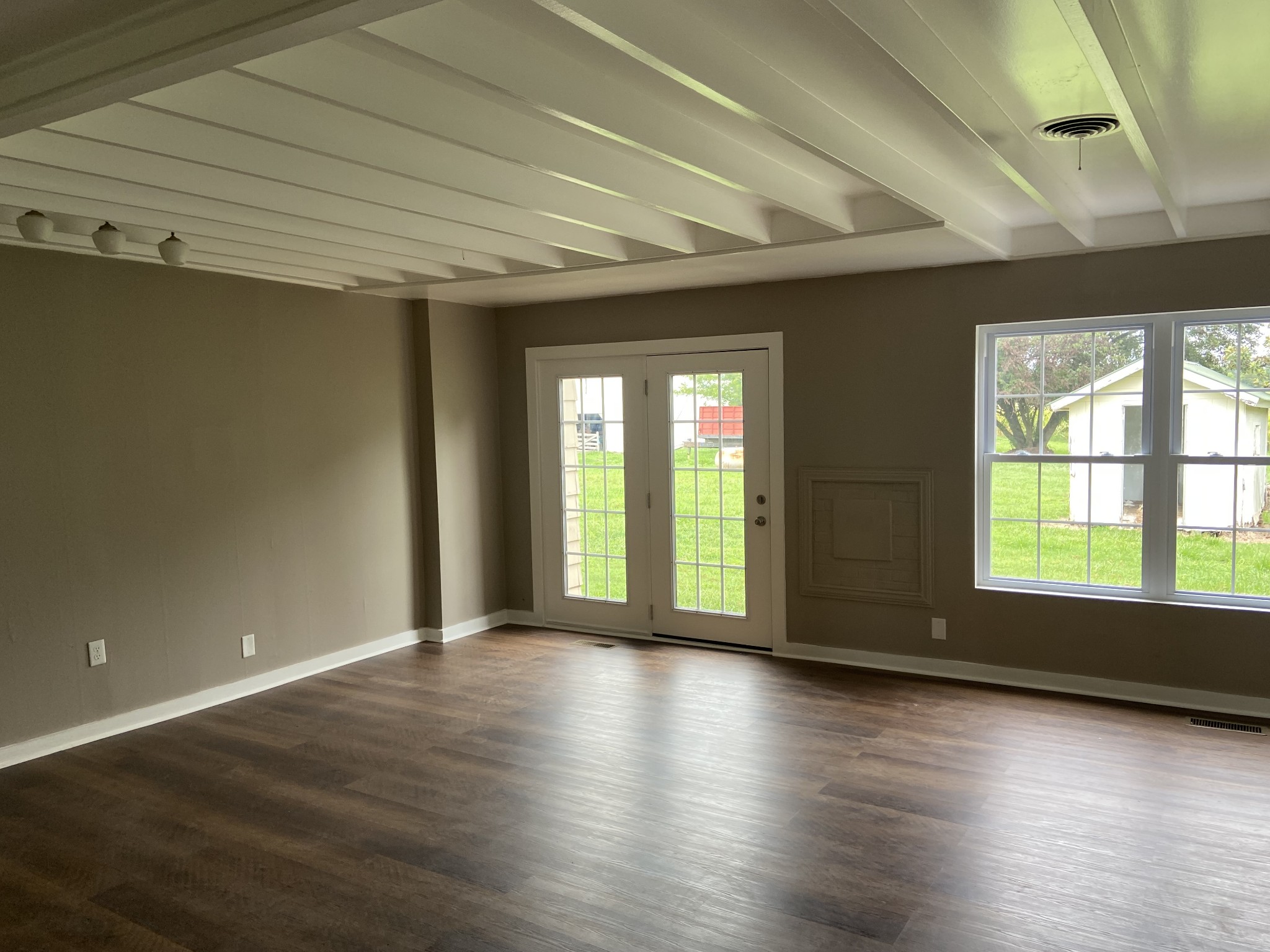 11495 Guthrie Road Guthrie, KY 42234 - Photo 12 of 43 an empty room with wooden floor and windows