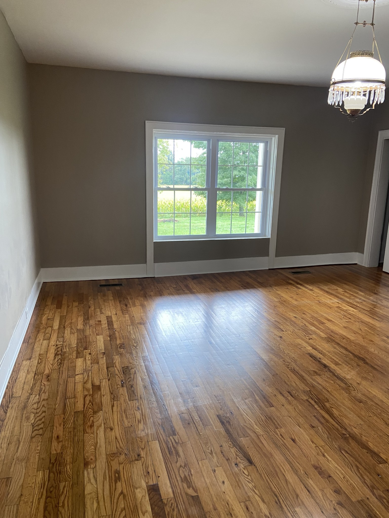 11495 Guthrie Road Guthrie, KY 42234 - Photo 24 of 43 a view of room with window wooden floor and front door