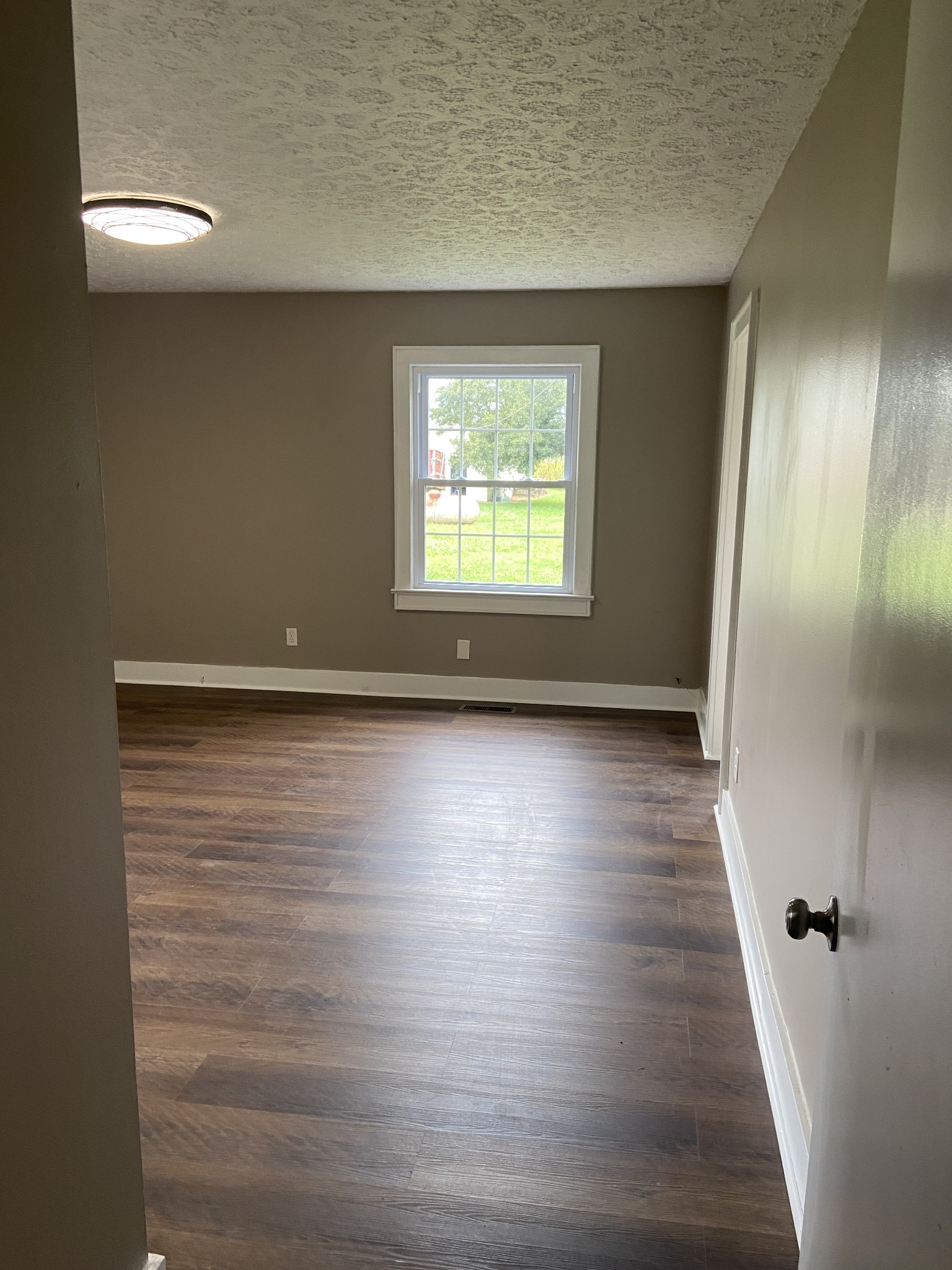 11495 Guthrie Road Guthrie, KY 42234 - Photo 27 of 43 a view of room with window and hardwood floor