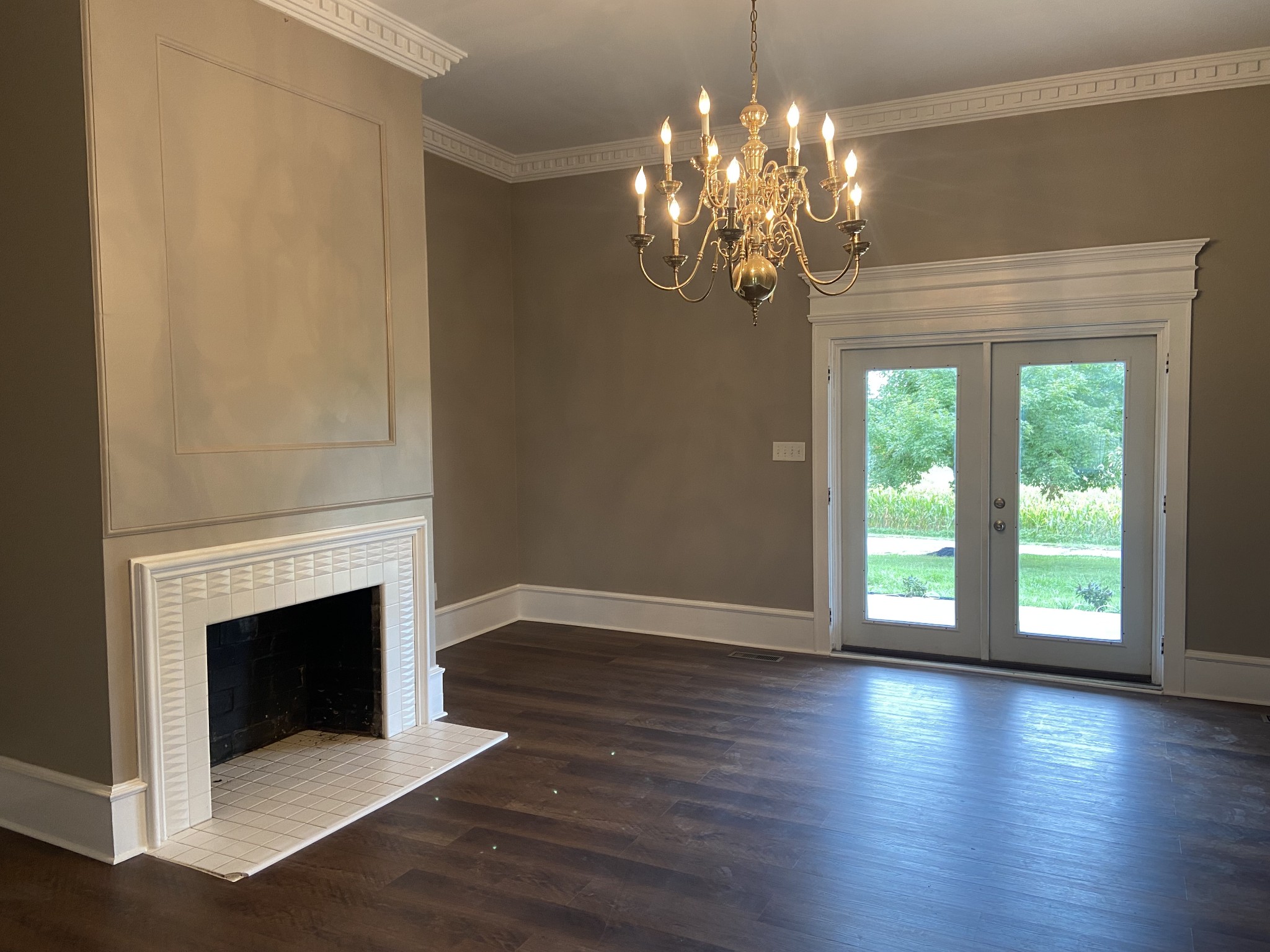 11495 Guthrie Road Guthrie, KY 42234 - Photo 9 of 43 a view of a livingroom with a fireplace wooden floor and windows