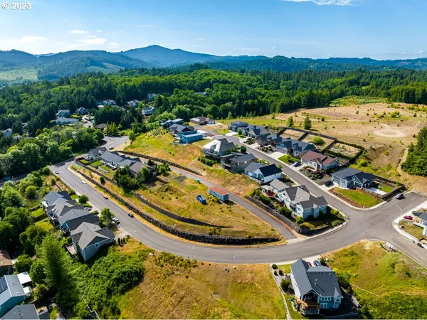 an aerial view of a house with a swimming pool