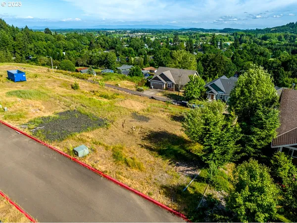 an aerial view of a house with a garden