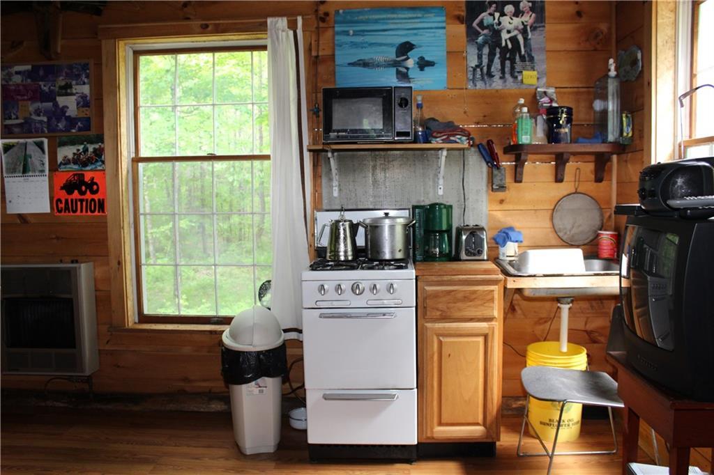 1 York Mill Athens, ME 04912 - Photo 11 of 23 Gas stove and oven. Camp wired for...