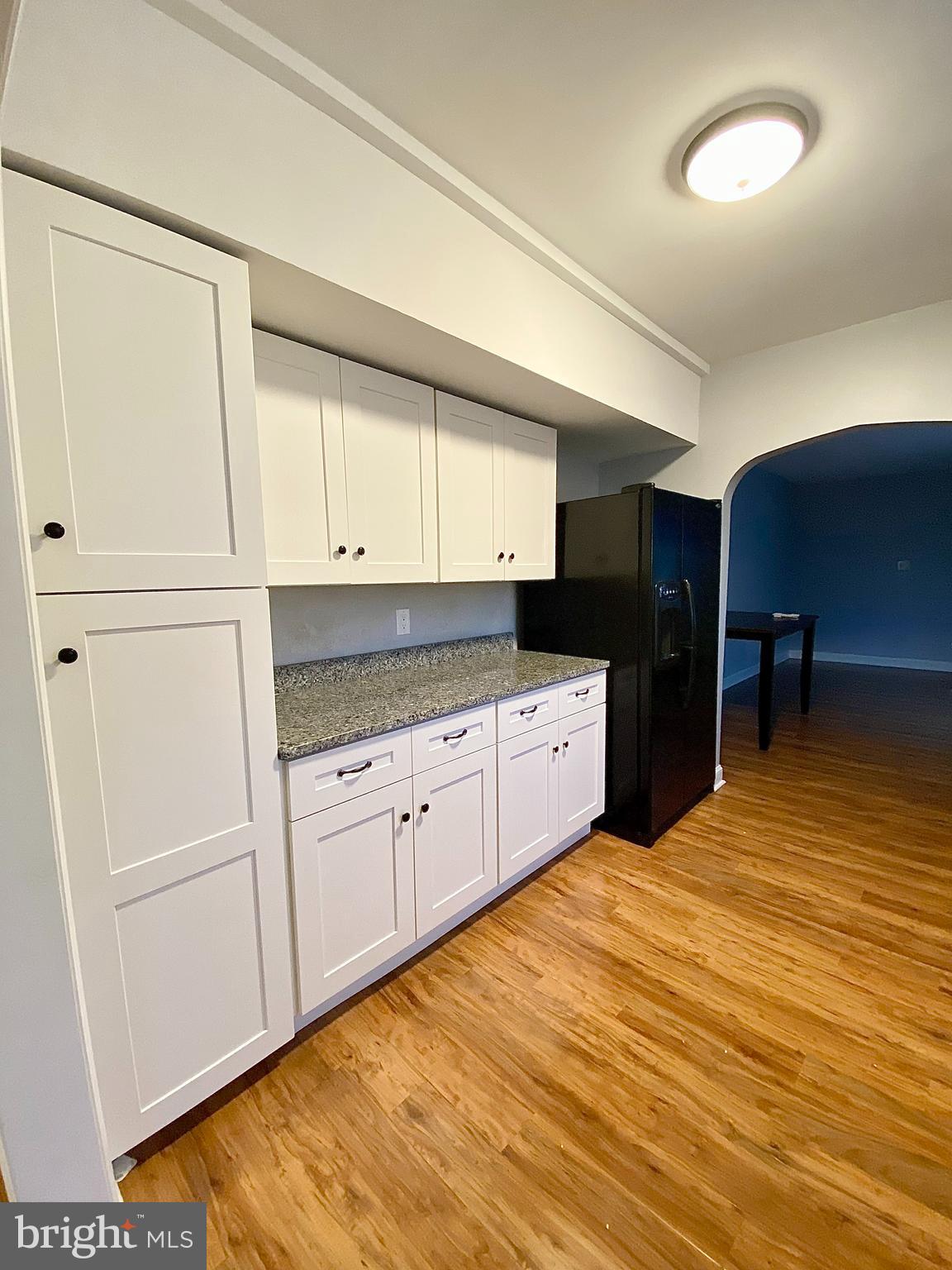 67 Main Street, Unit A Mantua, NJ 08051 - Photo 2 of 13 a kitchen with granite countertop a sink cabinets and stainless steel appliances