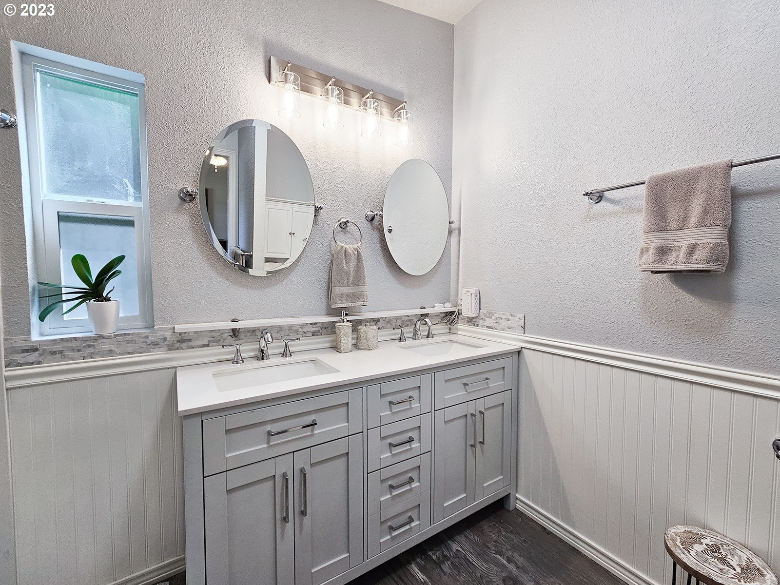 12450 Southwest Fischer Road, Unit 142 Tigard, OR 97224 - Photo 26 of 35 a bathroom with a double vanity sink and a mirror
