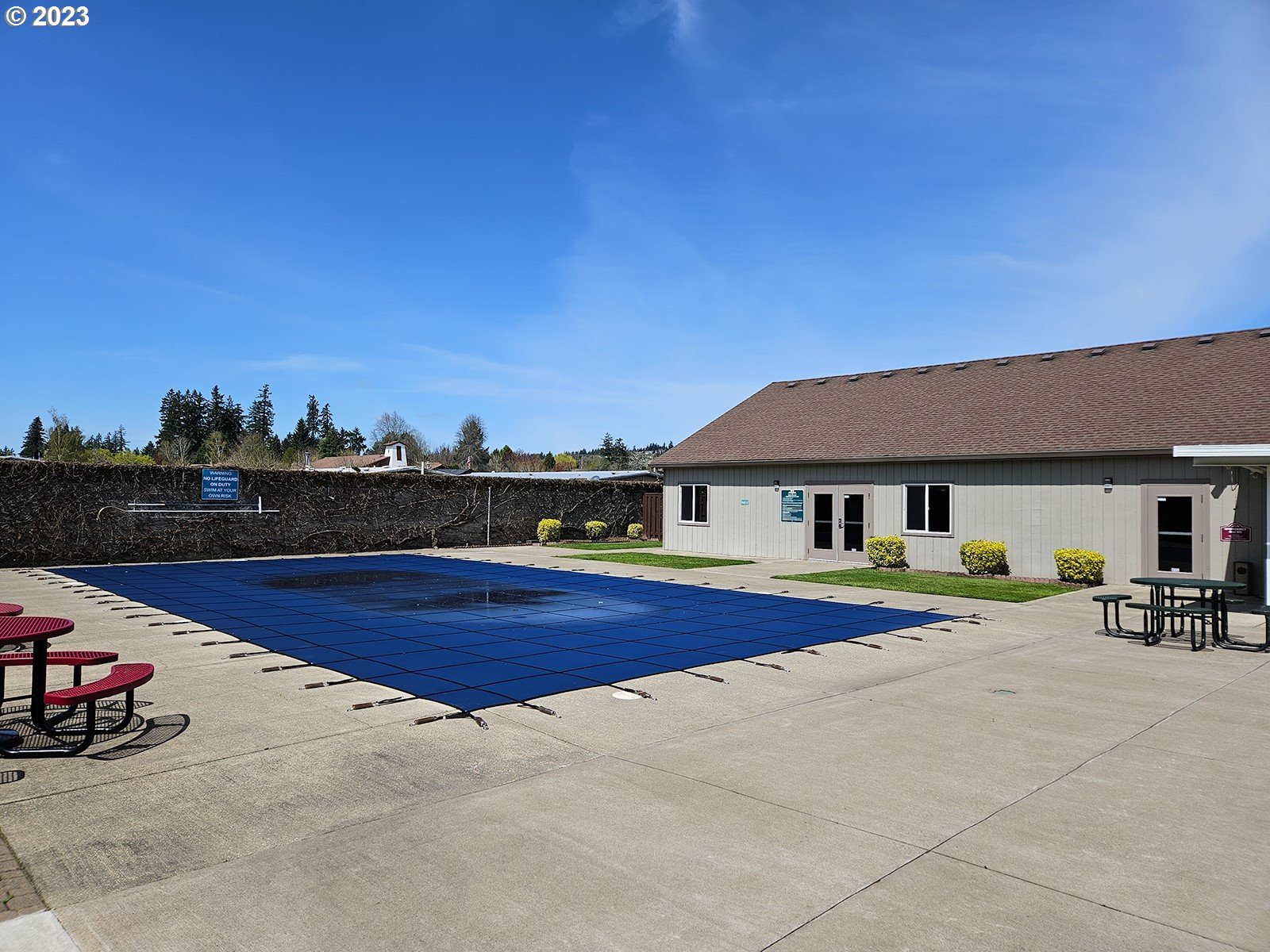 12450 Southwest Fischer Road, Unit 142 Tigard, OR 97224 - Photo 34 of 35 a view of a house with swimming pool and sitting area