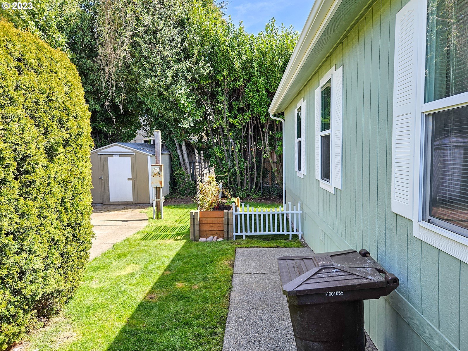 12450 Southwest Fischer Road, Unit 142 Tigard, OR 97224 - Photo 6 of 35 a view of a chair and table in backyard of the house