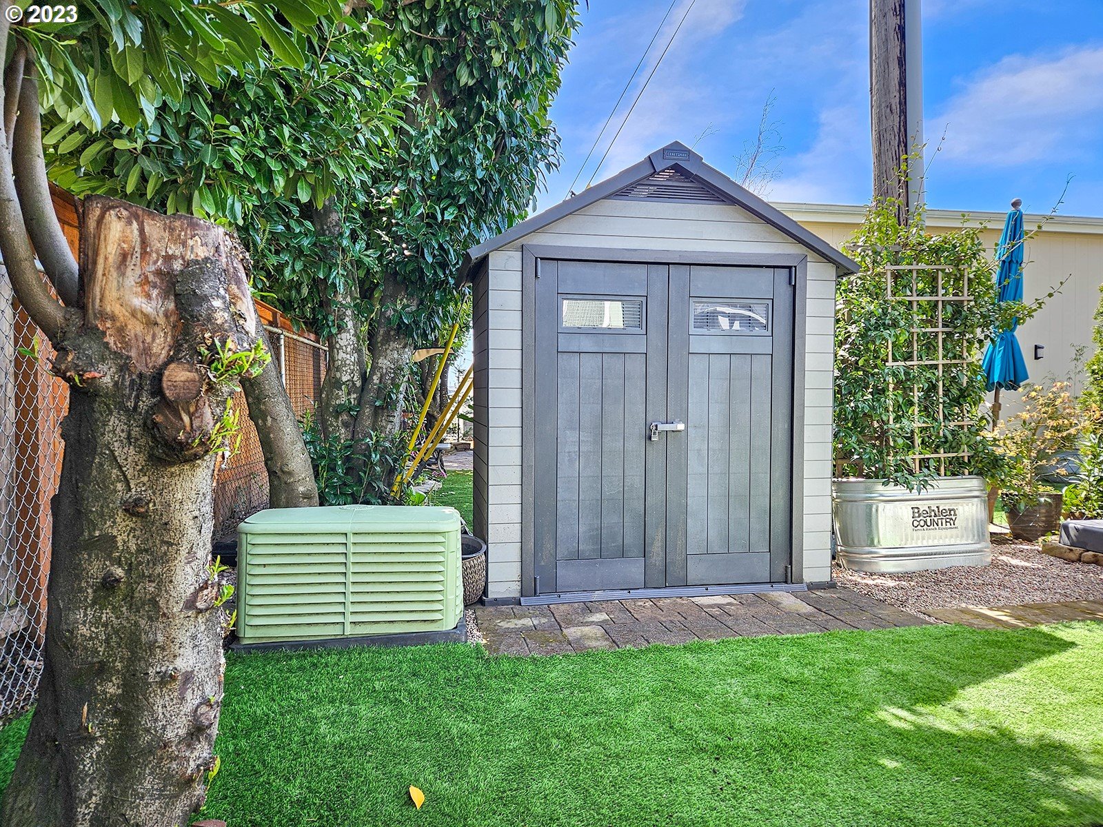 12450 Southwest Fischer Road, Unit 142 Tigard, OR 97224 - Photo 9 of 35 a front view of a house with a garden