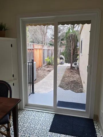 a view of a backyard with sitting area
