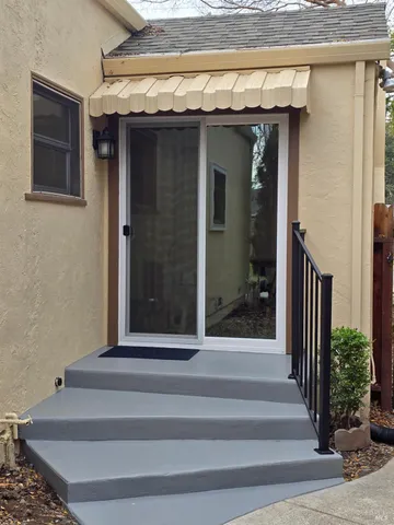 a view of a house with sitting area and furniture