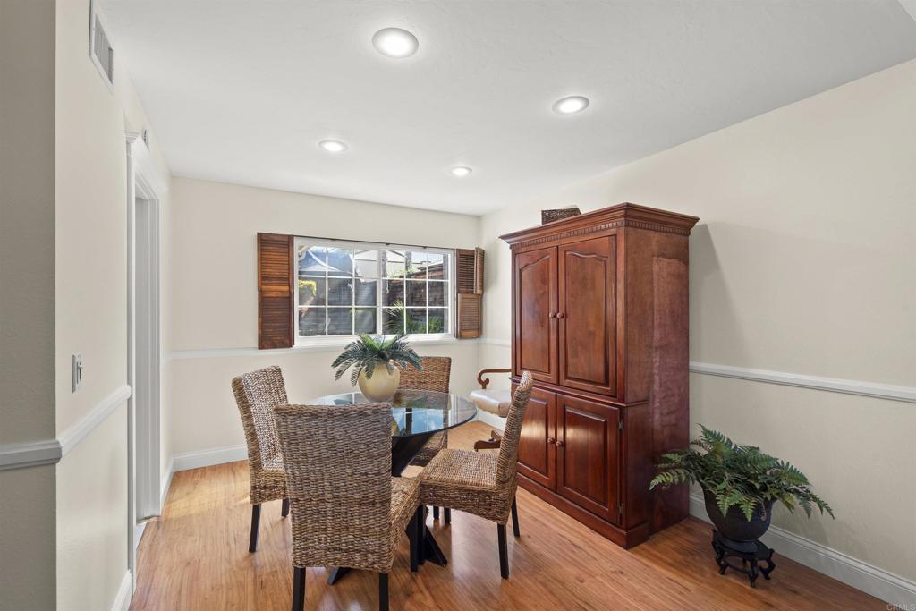 4627 Huggins Street University City, CA 92122 - Photo 14 of 54 a view of a dining room with furniture window and wooden floor