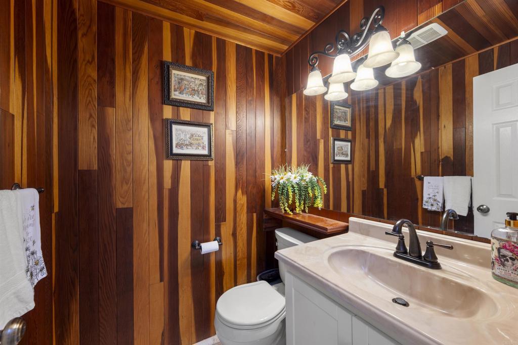 4627 Huggins Street University City, CA 92122 - Photo 23 of 54 a bathroom with a sink a toilet and mirror