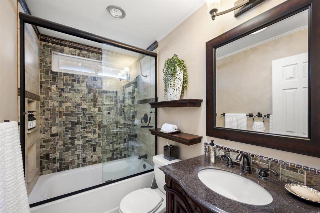 4627 Huggins Street University City, CA 92122 - Photo 28 of 54 a bathroom with a sink and a mirror