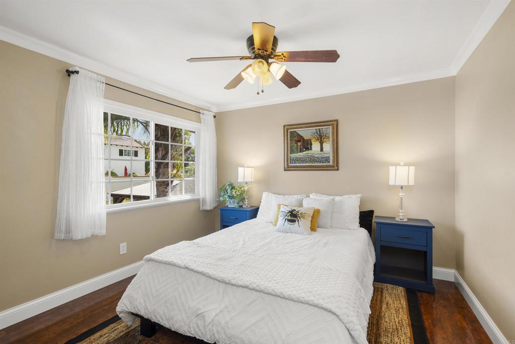 4627 Huggins Street University City, CA 92122 - Photo 29 of 54 a bedroom with a bed and wooden floor