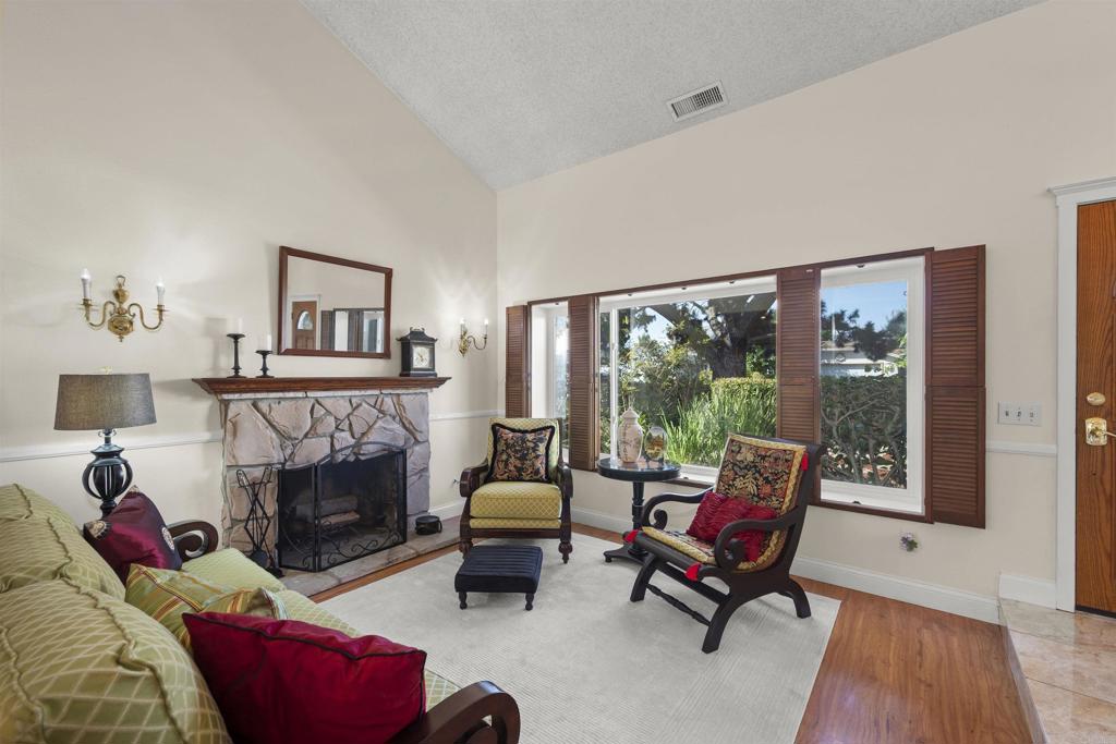 4627 Huggins Street University City, CA 92122 - Photo 10 of 54 a living room with furniture and a fireplace